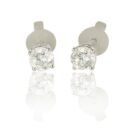 Classic Solitaire Diamond Earrings in 18K White Gold Dubai featuring two natural round brilliant diamonds totaling 0.79 carats in an elegant timeless stud setting