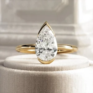 14K gold pear cut 2 carat lab grown diamond engagement ring Dubai UAE IGI certified half bezel setting