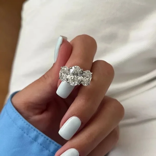 14K White Gold 4.5 CTW E VVS2 Oval Lab Grown Diamond Trilogy Ring IGI Certified
