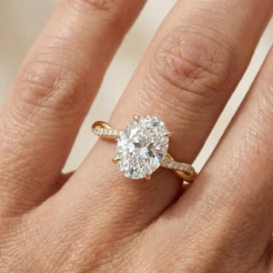 2.20 Ct oval diamond engagement ring with twisted pavé band in 14K yellow gold