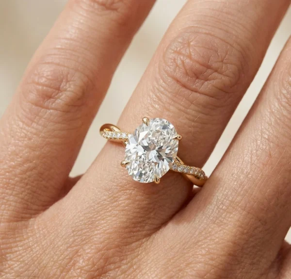2.20 Ct oval diamond engagement ring with twisted pavé band in 14K yellow gold