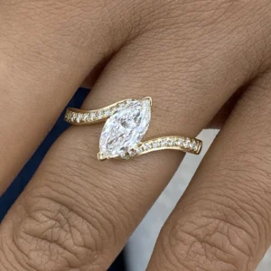 Marquise lab grown diamond engagement ring 14K yellow gold Dubai 1.15 CT IGI certified solitaire with round accent diamonds handcrafted UAE