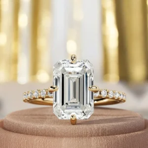 Shop a 4.35 CT emerald cut lab grown diamond ring in 14K yellow gold. IGI certified E VVS2 diamond, handcrafted in Dubai with free worldwide shipping.