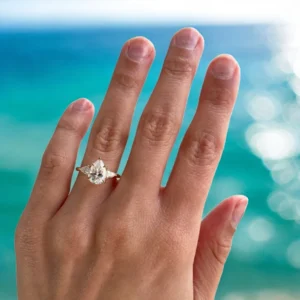 2.00 CT pear lab-grown diamond three stone engagement ring in 14K yellow gold handcrafted in Dubai
